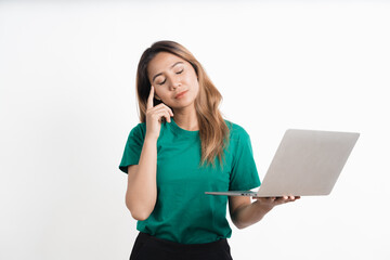 Portrait of happy young asian girl using laptop computer isolated over white background.