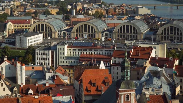 Urban infrastructure. Aerial view of the Riga town architecture in Latvia. The cityscape with Riga Central Market hangars in the capital. 