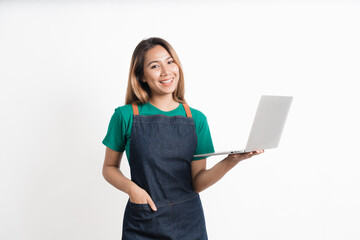 Young Asian business owners are excited by the good news while playing on computer laptop isolate on white background.