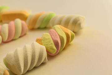 multi-colored marshmallows on a white background