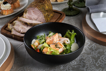 Salmon steak with salad to the New Year's table. New Year's decor, beautiful table. Horizontal photo
