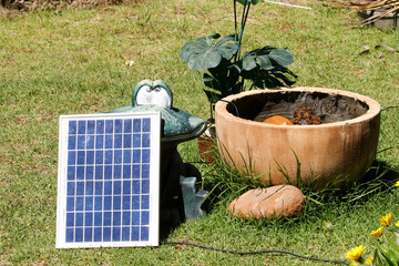 Solar panel used to power a garden feature fountain