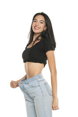 Fototapeta premium Weight loss happy woman isolated on a white background. Slim Body