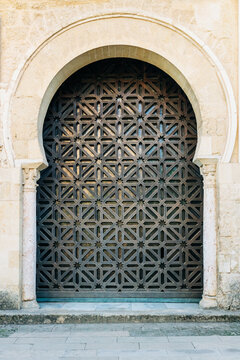Ancient door in arabic style, entrance to a historical building.