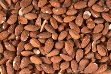 almond is the seed of the fruit of the almond tree Prunus dulcis, a species of tree in the Rosaceae family. Considered a chestnut dry fruit