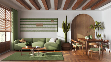 Wooden farmhouse living and dining room in white and green tones. Fabric sofa, table with chairs and decors. Contemporary interior design
