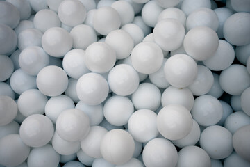 Many white plastic balls for dry pool.