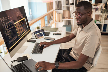 Devops engineer identifying technical problems and developing software updates and fixes