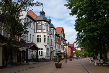Obraz premium View of the tourist street in the historical center of the Baltic sea resort Zelenogradsk - Kurortny Prospekt on a summer morning, Kaliningrad region, Russia