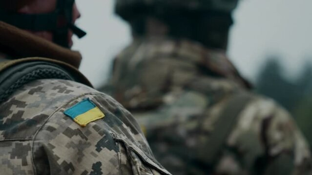 Ukrainian flag patch on the shoulder of a soldier of the armed forces of Ukraine