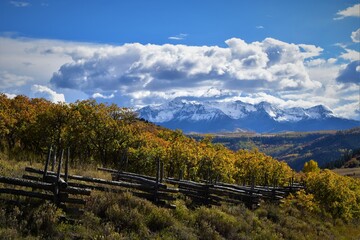 Wooden fence with cloudy background