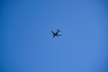 airplane in clear sky. travel with a plane in a minimalism photography