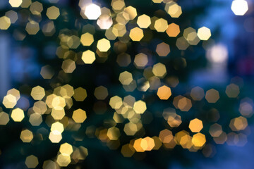 Bokeh background for christmas and new year, defocused round lights in golden and blue color, flare...