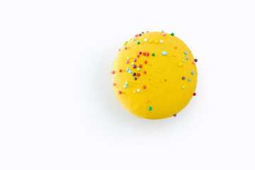 Yellow French macaroon isolated on white background. Tasty colorful macaroons. French pastry made from egg whites. Culinary and cooking concept.