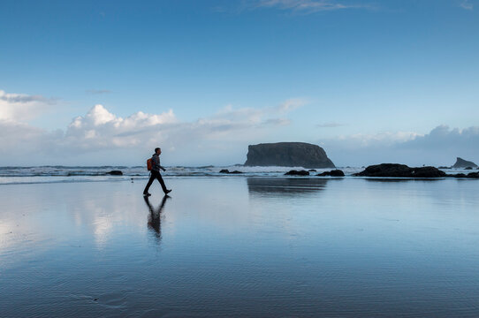 morning walk on Bandon beach with the Table Rock in the background, Oregon, USA