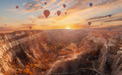 Beautiful sunset landscape autumn with hot air balloons in Cappadocia, Turkey valley from aerial view