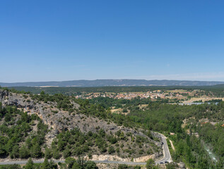 Fototapeta na wymiar Panoramic view from the viewpoint of Ventano del Diablo, mountains, trees and lots of countryside. Cuenca (Spain)