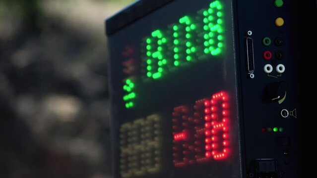 Sports car race countdown digital timer, stopwatch at the finish of the race. Closeup
