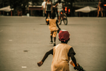 Two black kids playing in the street