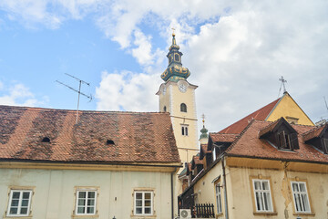 Obraz premium St Mary's Church tower and old buildings in Zagreb, Croatia. High quality photo