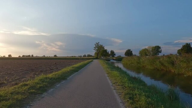 Cycling in the countyside near Abbiategrasso, lombardy, Italy