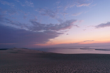 Twilight after sunset with view at the sea on a huge natural sand formation on the Dune du Pilat,...