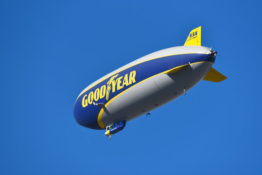 IRVINE, CALIFORNIA - 27 NOV 2022: The Goodyear Airship Wingfoot Three against a bright blue sky.