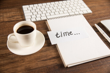 Notepad with inscription time, keyboard and coffee