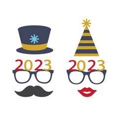 Party glasses and greetings decorated with a hat and stars, ready to be used in New Year's Eve party for 2023.