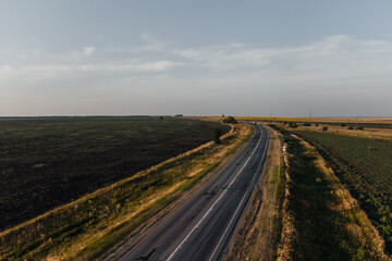 the track in the rays of sunset taken from a drone