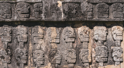 The Tzompantli of Chichen Itza ruins in Mexico. The wall of skulls.