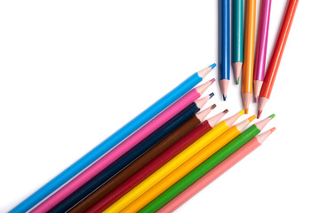 Colored pencils isolated on a white background, a place for advertising.