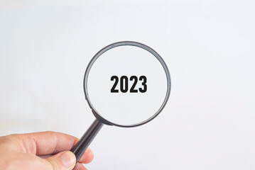 2023 was written with a magnifying glass. sustainable future idea.new business goal strategy concept.2023 goal planning business concept