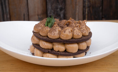 Chocotorta. Closeup view of a cake made with chocolate cookies and dulce de leche cream, in a white dish.
