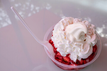 Strawberry Shortcake Ice Cream Sundae on a White Table, Offset Right