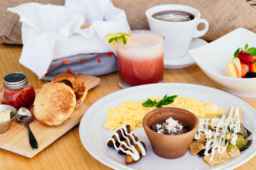 Breakfast served at the table, bread, food and drinks. Healthy lifestyle.