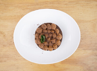 Chocotorta. Top view of a cake made with chocolate biscuits and dulce de leche cream, in a white dish. 