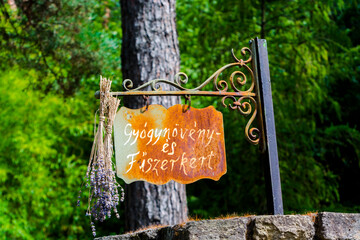 Sign in a botanical garden with lavender