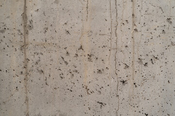 Concrete texture background with holes and damage. vertical photo