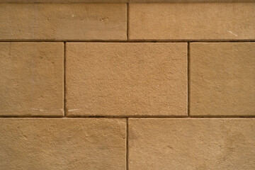 Background texture of restored old wall, pattern and symmetry, orange rectangular blocks. landscape photo