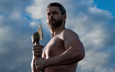 shirtless man with axe. woodman man hold ax. brutal man on sky background
