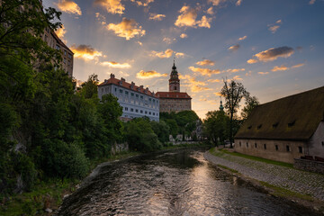 Dreamy morning view through iconic historical city Cesky Krumlov with magical sky in south of Bohemia, Europe.