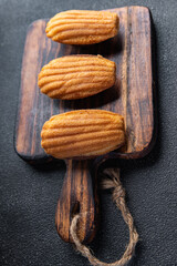 French dessert biscuit cookies Madeleine sweet meal food snack on the table copy space food background rustic top view