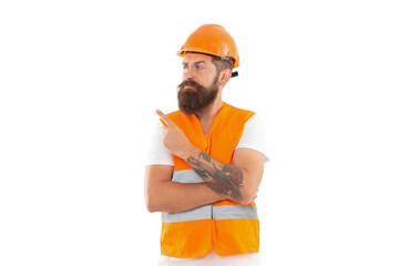 engineer man in uniform point finger. bearded engineer in orange vest. studio shot of engineer