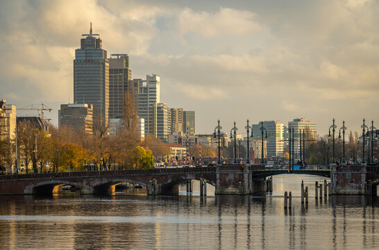 Skyline of Amsterdam with river Amstel in the foreground and modern high-rise office buildings in Omval neighbourhood