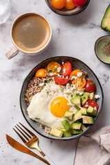 Keto diet plate quinoa, avocado, egg and tomatoes. Healthy food, ketogenic diet