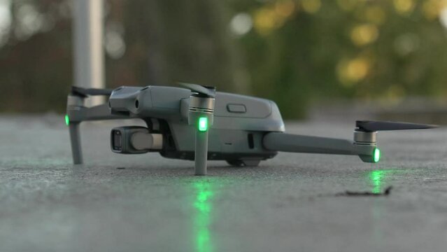 Closeup shot of small drone taking off from the ground