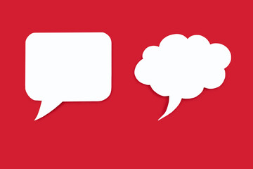 Two speech bubbles of different shapes on a red background. Empty speech bubbles in the form of a square and a cloud. Free space for text. The concept of speech communication or chat on the Internet