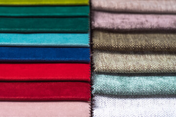 Bright collection of colorful textile samples. Fabric swatches, set in different colors for selection. Variety colors of upholstery material for furniture and interior. Fabric texture background