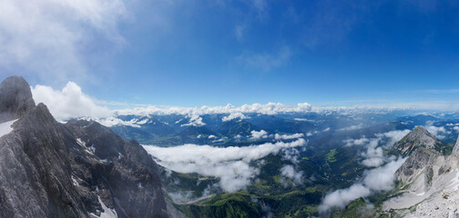 Fototapeta na wymiar Amazing wide open panoramic view from Dachstein Peak in Austria. Near Schladming and Ramsau. Highest Peak in Upper Austria and Styria